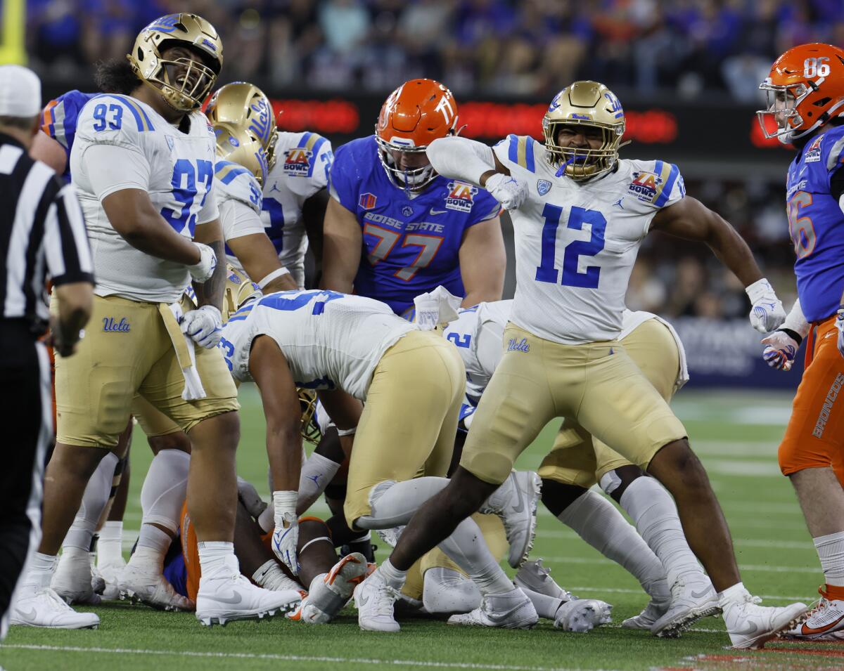 UCLA's Jay Toia, far left, and Grayson Murphy celebrate a defensive stop in the second half against Boise State.