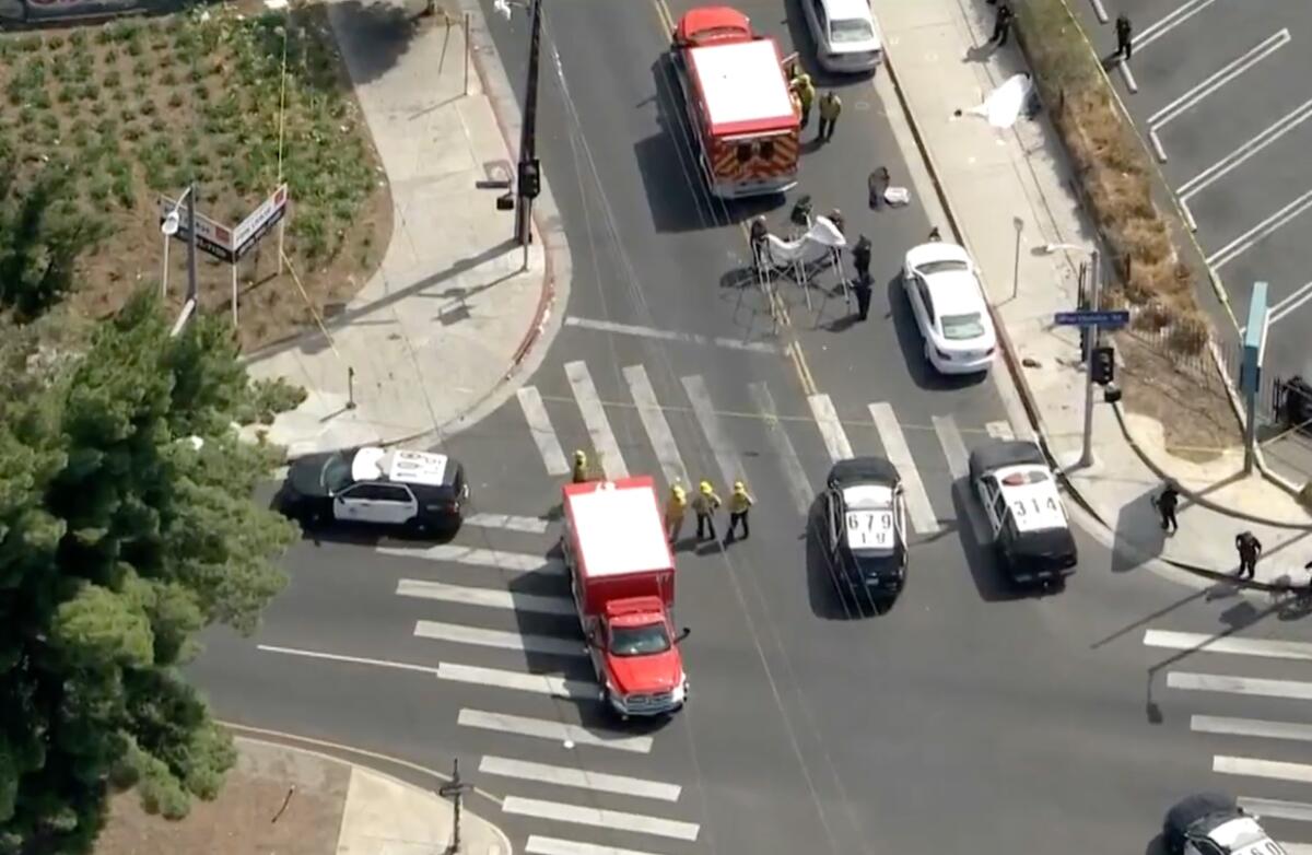Aerial view of police and firefighters in a closed-down intersection
