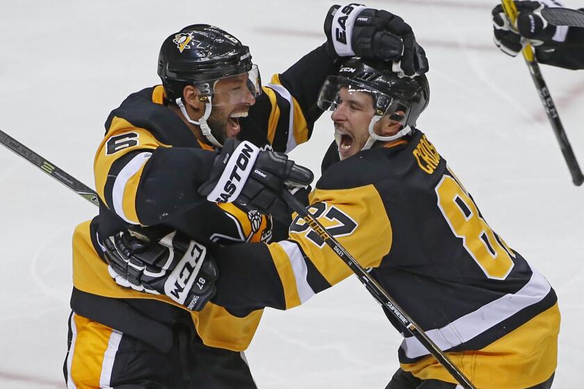 Penguins defenseman Trevor Daley (6) and forward Sidney Crosby (87) celebrate Patric Hornqvist's game-winning goal in overtime against the Capitals on May 4.