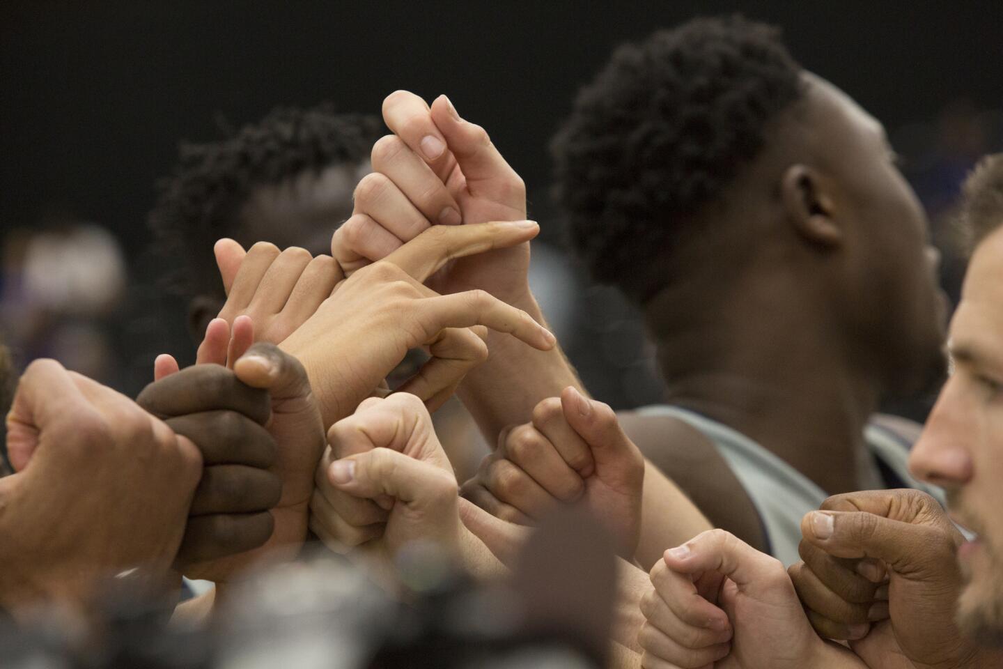 Players from a variety of nations huddle during a training session at the global camp in El Segundo.