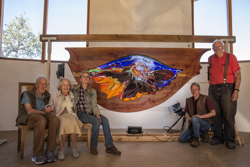 James and Anne Hubbell, left, the artists who re-created the firebird stained glass window.