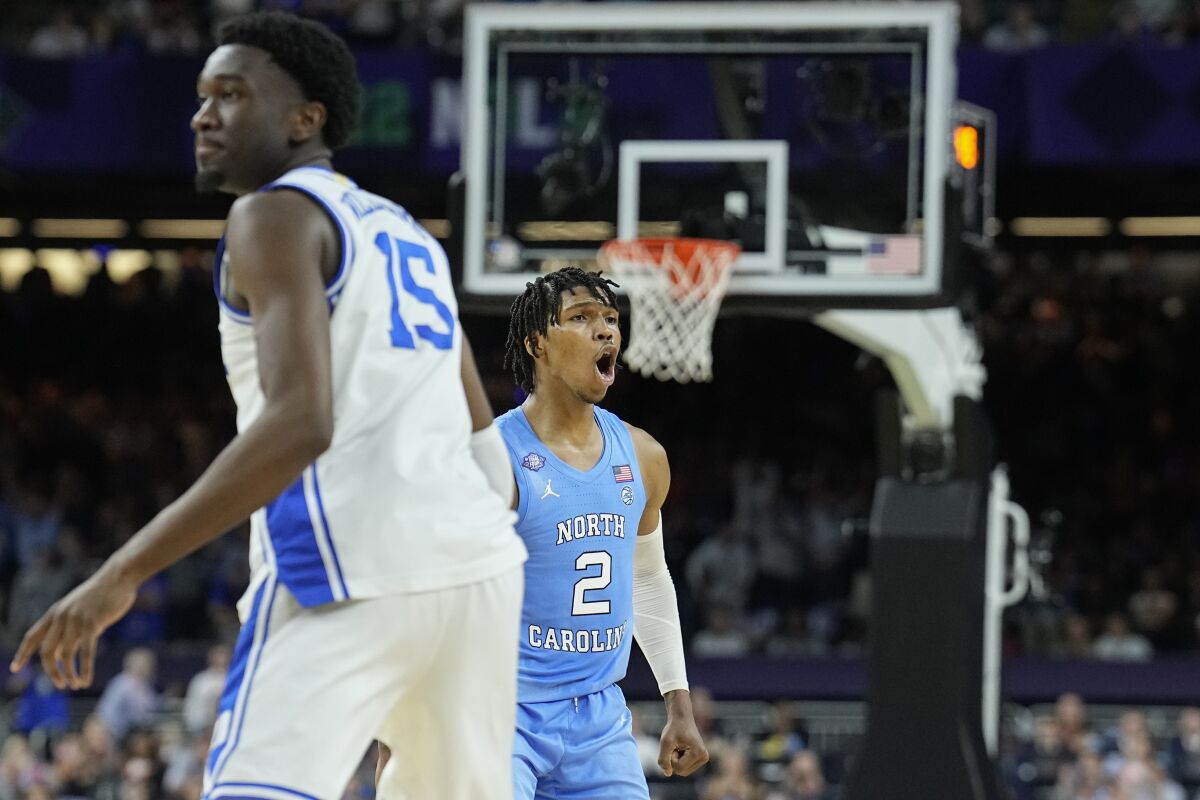 North Carolina guard Caleb Love (2) celebrates after scoring against Duke during the second half April 2, 2022.