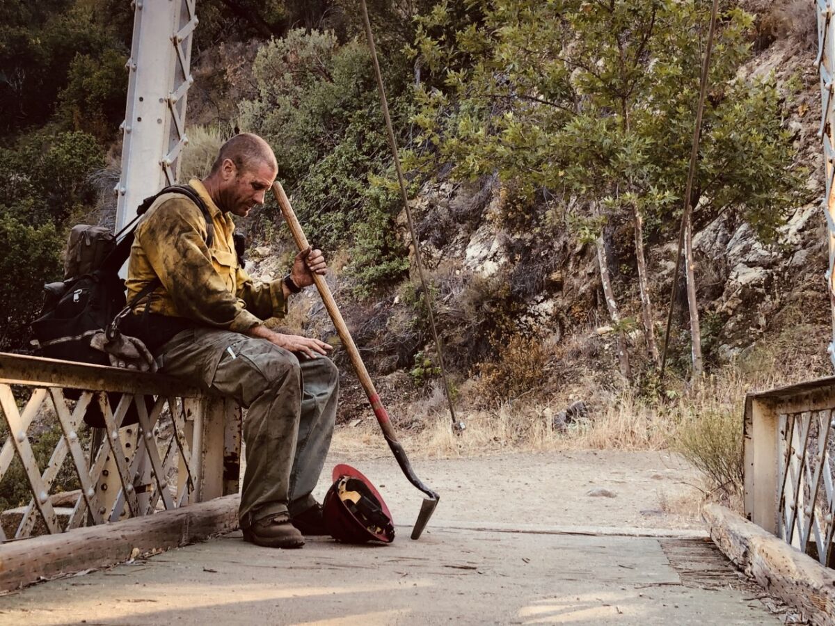 Captain Justin Grunewald takes a short rest amid his battle against the Willow fire.