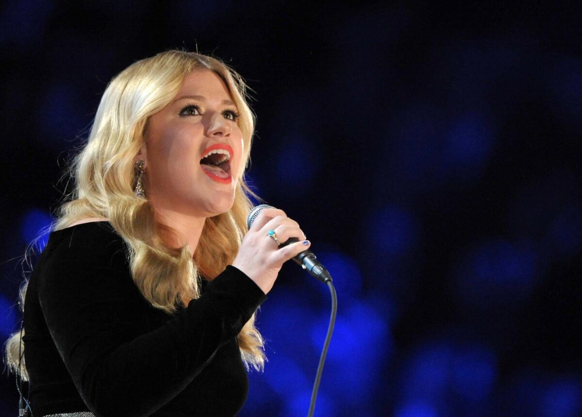 Kelly Clarkson performs on stage at the 55th annual Grammy Awards in Los Angeles.