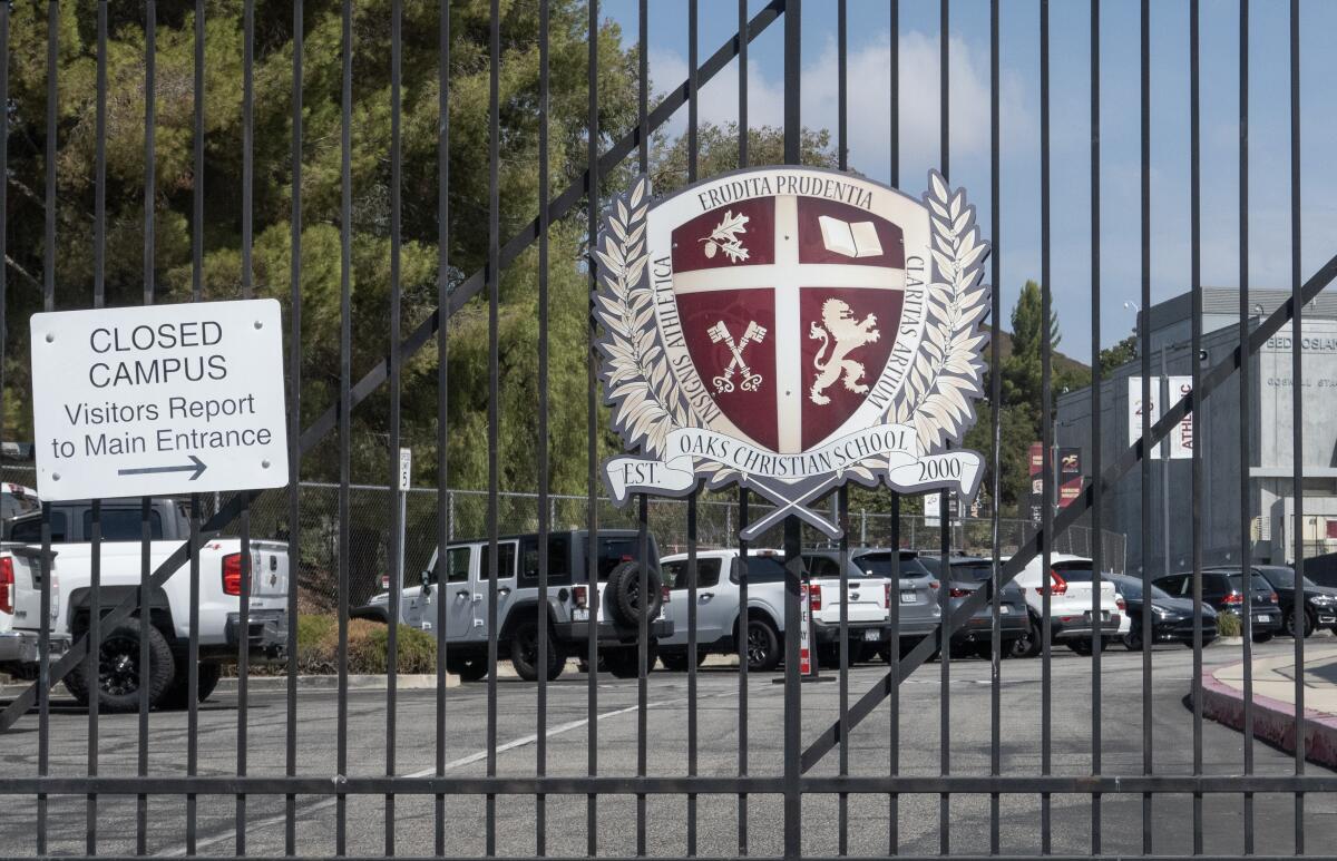 Closed wrought-iron gates at Oaks Christian School in Westlake Village.