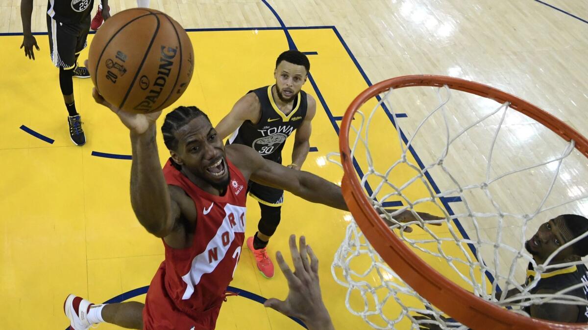 Kawhi Leonard attempts a shot against the Golden State Warriors during Game 6 on June 13, 2019 in Oakland.