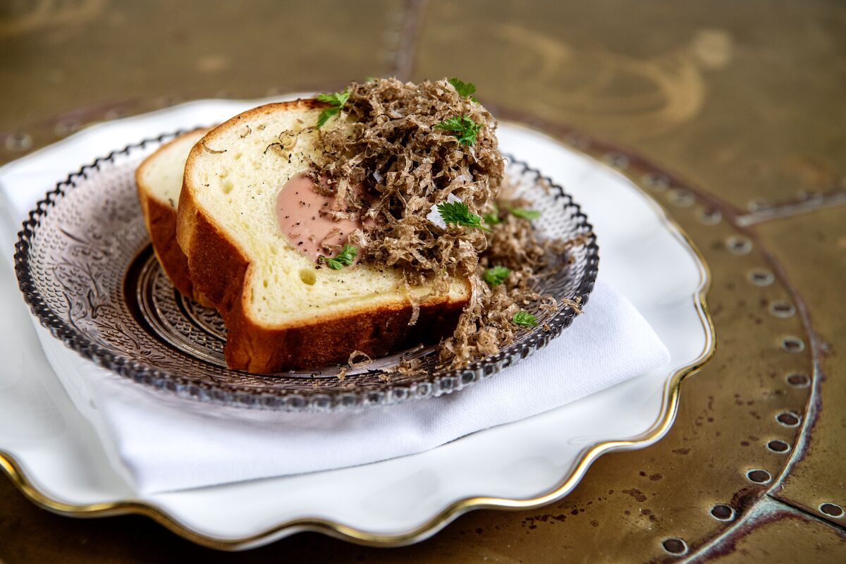 Foie de poulet à la Strasbourgeoise, or chicken liver stuffed in brioche and covered in shaved truffles.