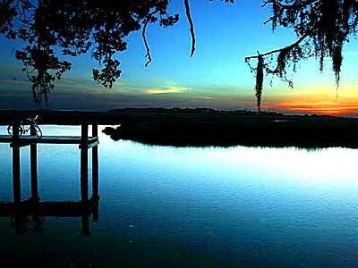 The sun sets over the marshlands of Sapelo Island, Ga., one of the Sea Islands off the Atlantic Coast. Access to the island, reached in 30 minutes by ferry, is tightly controlled.