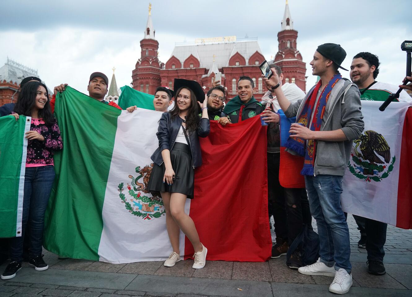 MOSCOW, RUSSIA - JUNE 11: Football fans from Russia and Mexico pose for selfies together near Red Square ahead of the World Cup on June 11, 2018 in Moscow, Russia. Moscow and Russia is gearing up for the start of the World Cup tournament. FIFA expects more than three billion viewers for the World Cup that begins this week in Russia. (Photo by Christopher Furlong/Getty Images) ** OUTS - ELSENT, FPG, CM - OUTS * NM, PH, VA if sourced by CT, LA or MoD **