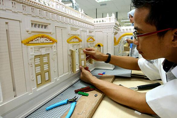 A Legoland Malaysia model builder works on the Sultan Abu Bakar state mosque, which took more than six weeks to complete.