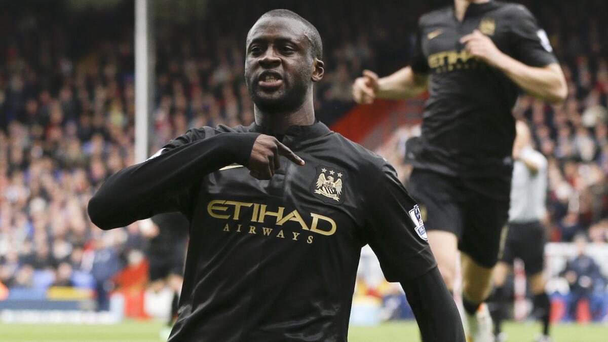 Manchester City's Yaya Toure celebrates after scoring a goal against Crystal Palace in English Premier League competition on April 27. Toure will be representing Ivory Coast in next month's World Cup.