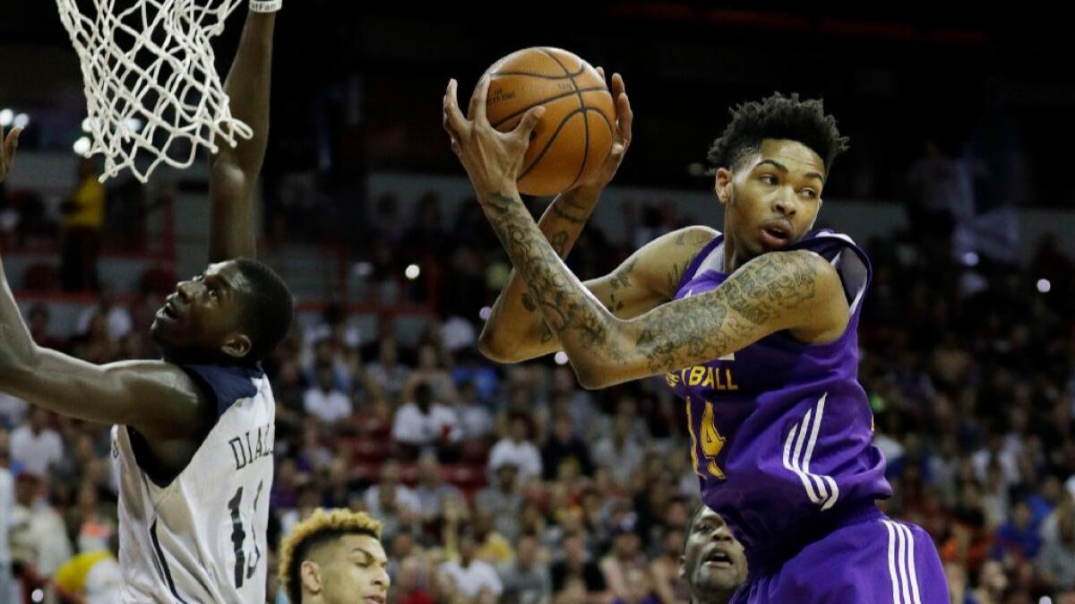 Lakers rookie Brandon Ingram grabs a rebound during a summer league game against the Pelicans on July 8.