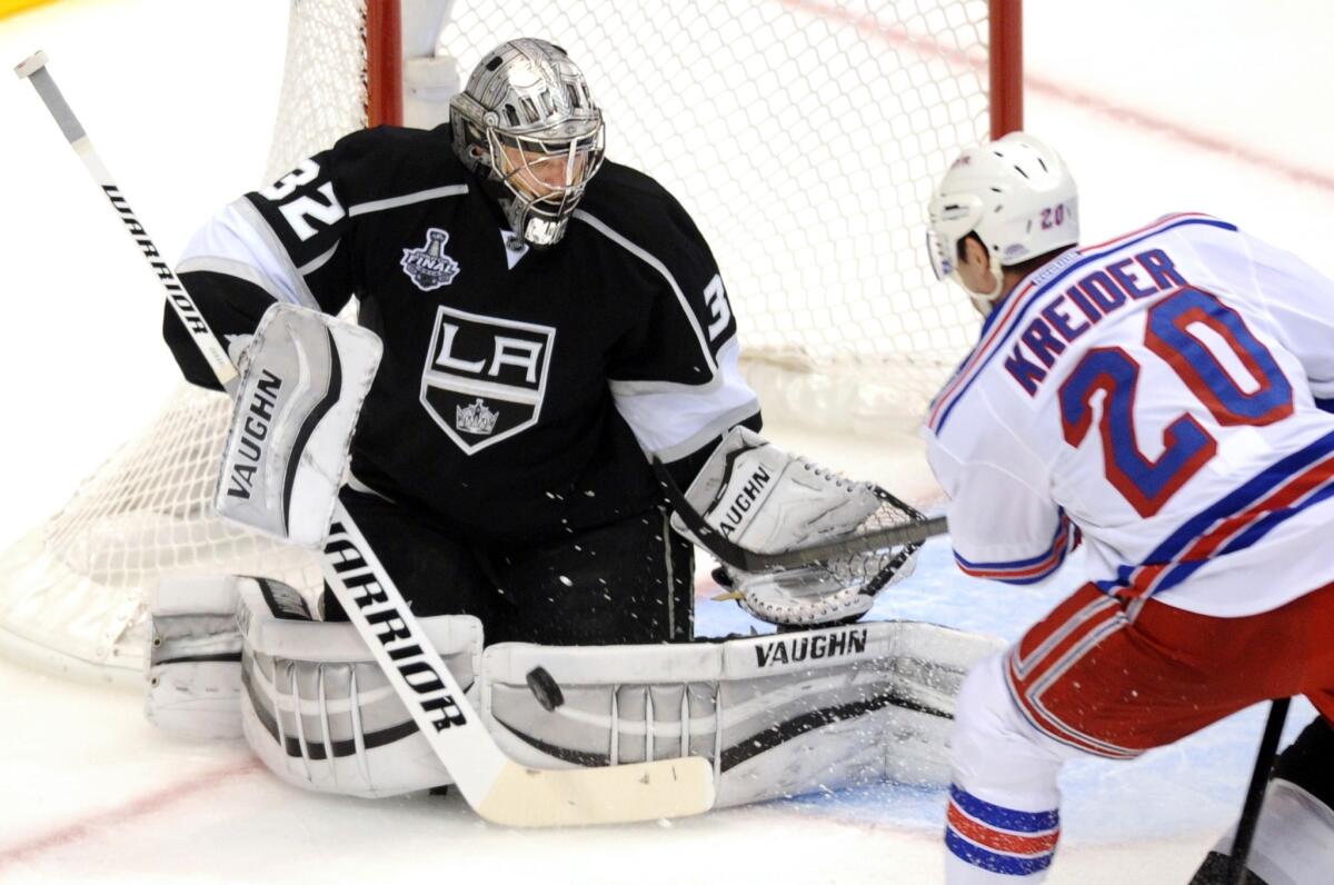 Kings goalie Jonathan Quick stops a shot by Rangers left wing Chris Kreider in the first period.