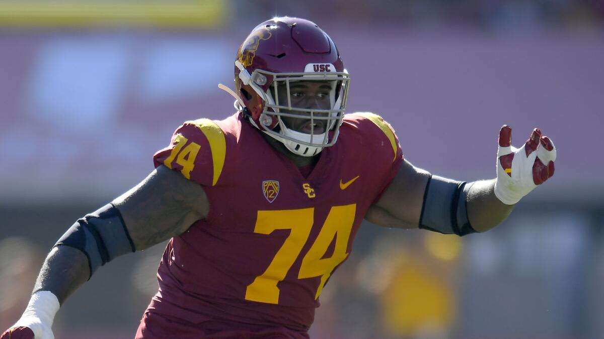 USC offensive lineman Courtland Ford guards San Jose State Spartans defenders on Sept. 4 at the Coliseum.