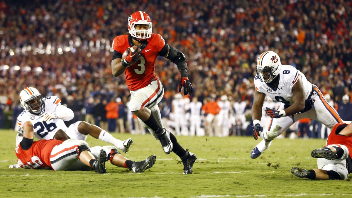 Georgia running back Todd Gurley carries the ball on a touchdown run during the Bulldogs' 34-7 victory over Auburn on Saturday.