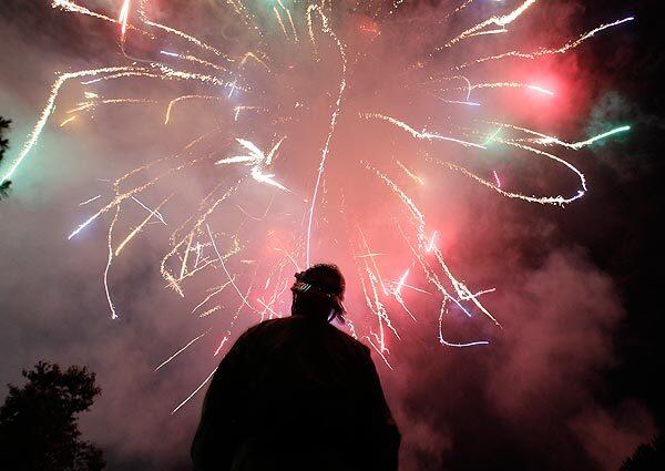 Pasadena hazardous materials specialist James Whecker keeps an eye on fireworks at the Rose Bowl.