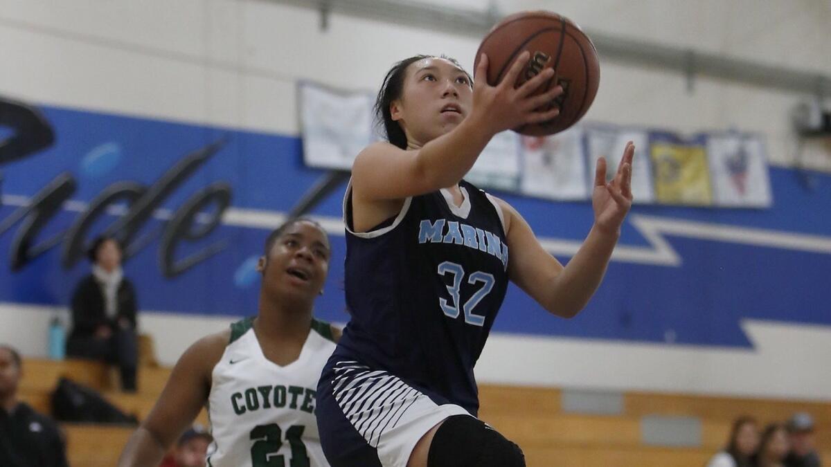 Katie Nguyen (32) has led the Marina High girls' basketball team to a 10-3 start, a season after the Vikings went 4-22.