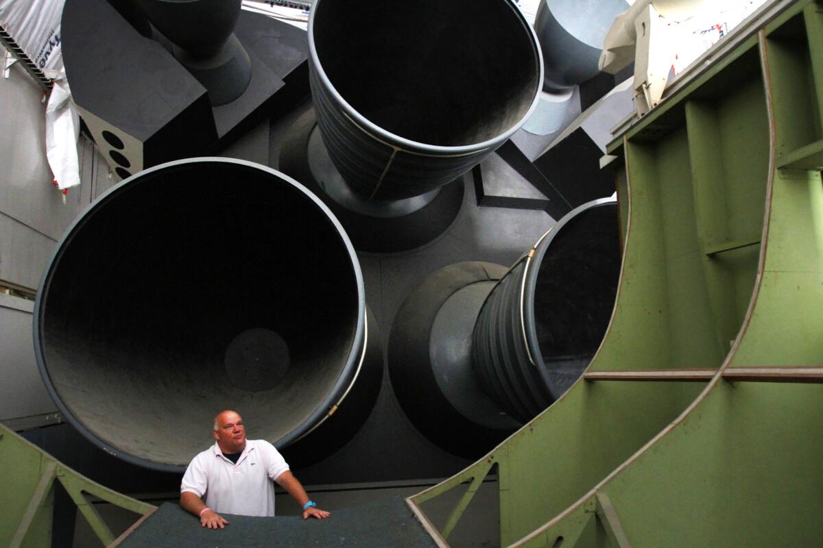 June 13, 2012: Tom Messmer, senior vice president of Downey Studios, the front of rocket nozzles of space shuttle mockup.