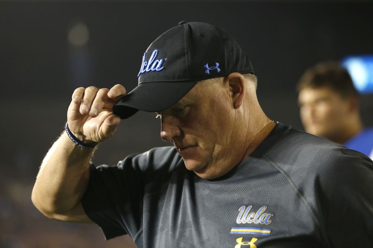 UCLA coach Chip Kelly walks off the field following the Bruins' 48-14 loss to Oklahoma at the Rose Bowl on Saturday.
