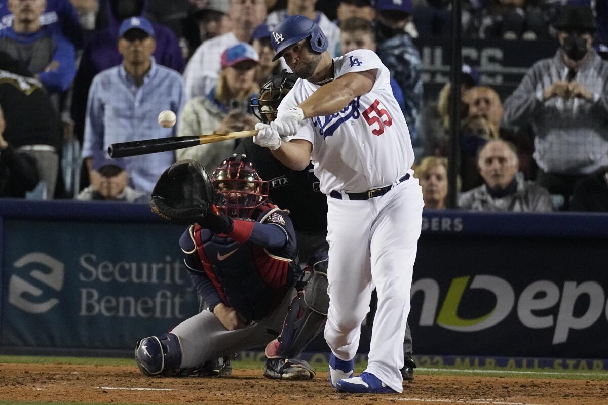 Los Angeles Dodgers' Albert Pujols singles in the seventh inning 