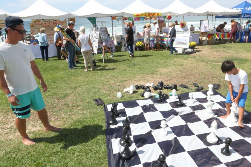 Guests at the 2019 Del Mar Foundation picnic at Powerhouse Park playing lawn chess.