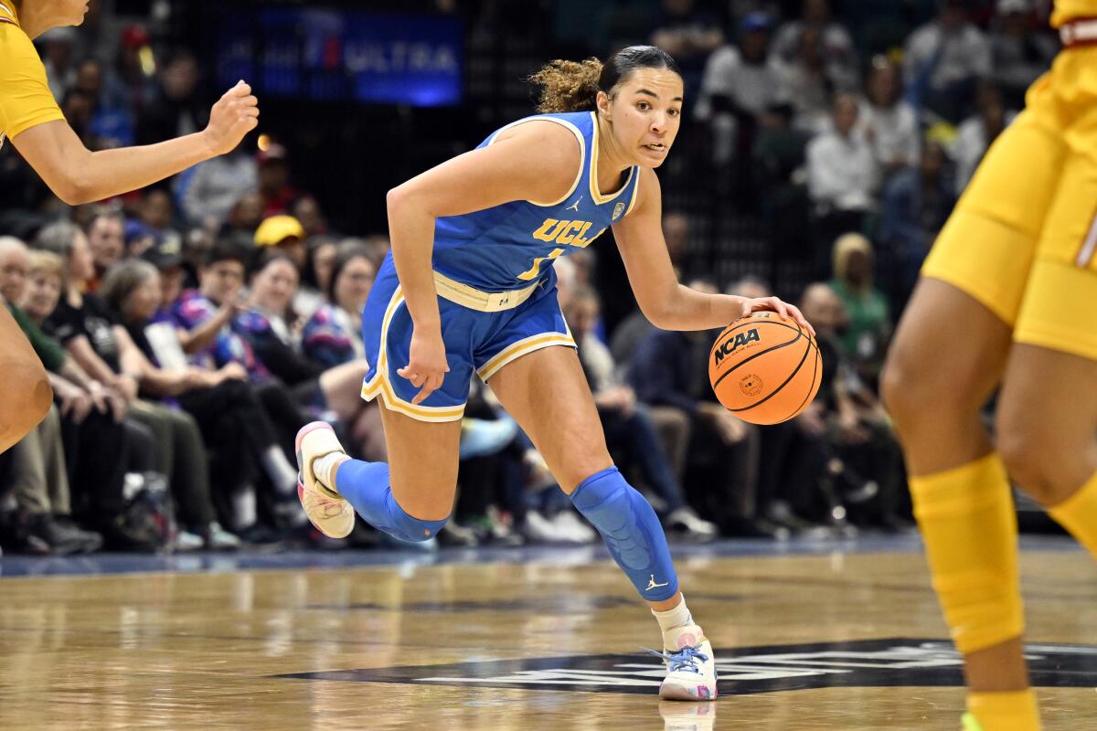 UCLA guard Kiki Rice drives to the basket against USC in the Pac-12 tournament on March 8.