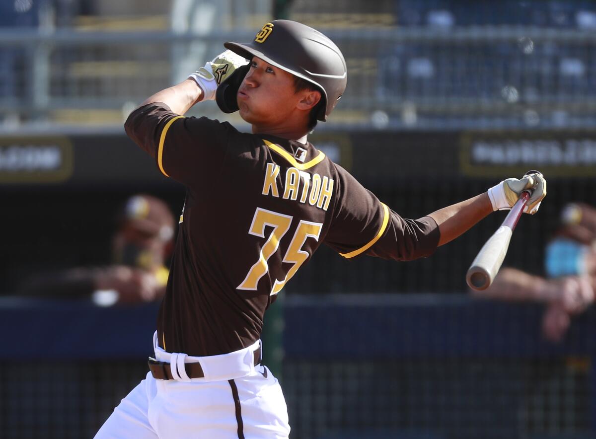 Padres infielder Gosuke Katoh hits a home run against the Milwaukee Brewers in Wednesday's spring training game.