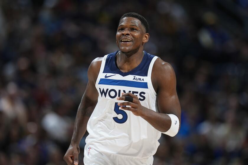 Minnesota Timberwolves guard Anthony Edwards reacts after hitting a basket in the first half of Game 1 of an NBA basketball second-round playoff series against the Denver Nuggets, Saturday, May 4, 2024, in Denver. (AP Photo/David Zalubowski)