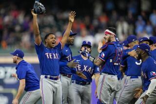 The Texas Rangers celebrate after Game 7 of the baseball AL Championship Series.
