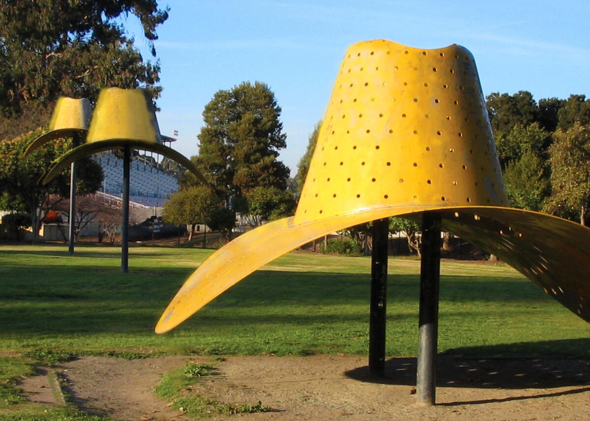 Officially titled "Hat in three stages of landing," the artwork was built by Claes Oldenburg in 1982.