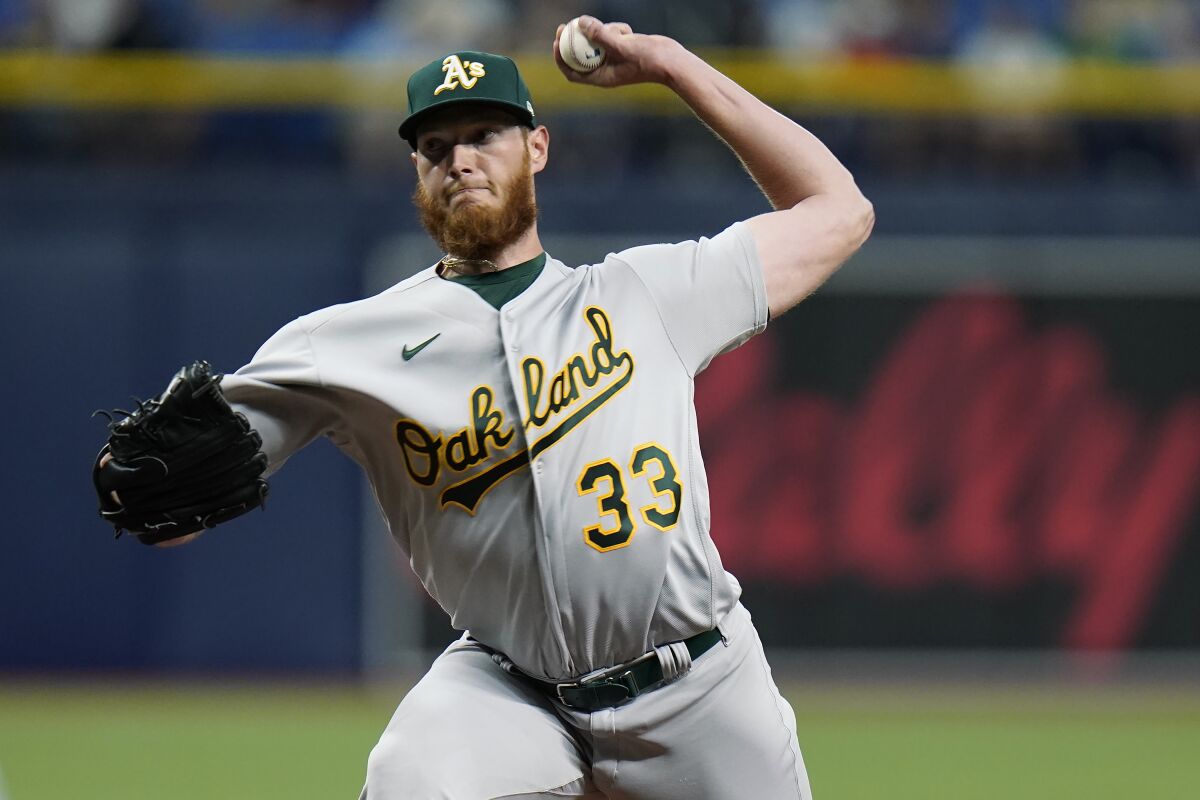 Oakland Athletics starting pitcher A.J. Puk delivers to the Tampa Bay Rays during the eighth inning of a baseball game Monday, April 11, 2022, in St. Petersburg, Fla. (AP Photo/Chris O'Meara)
