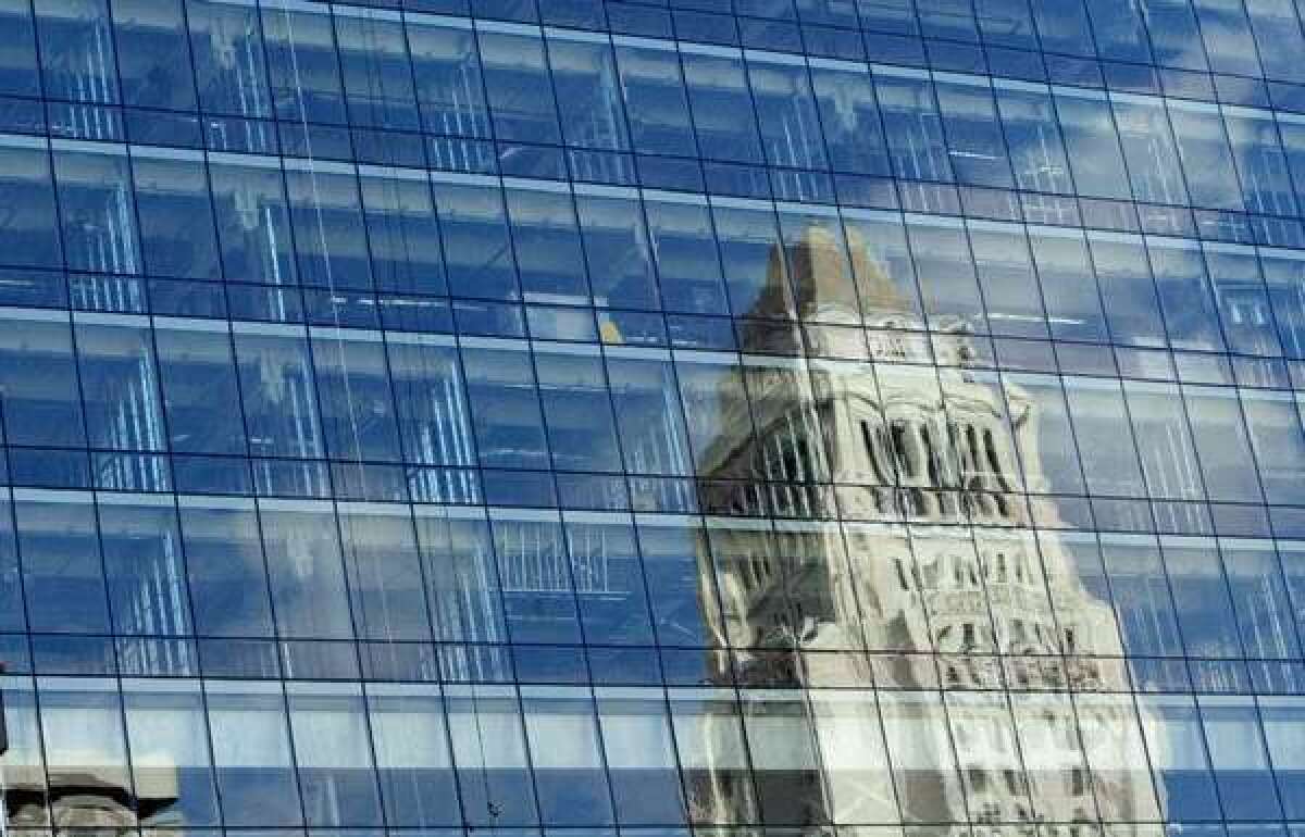 Los Angeles City Hall, as reflected in the windows of Police Department headquarters.
