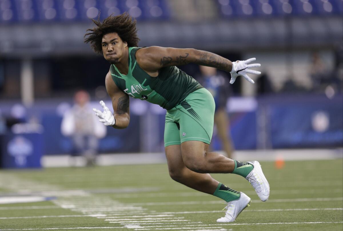 Defensive lineman Leonard Williams performs a drill at the NFL football scouting combine in Indianapolis on Feb. 22.