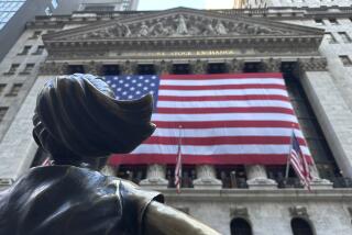 FILE - The Fearless Girl statues faces the New York Stock Exchange on July 2, 2024, in New York. (AP Photo/Peter Morgan)