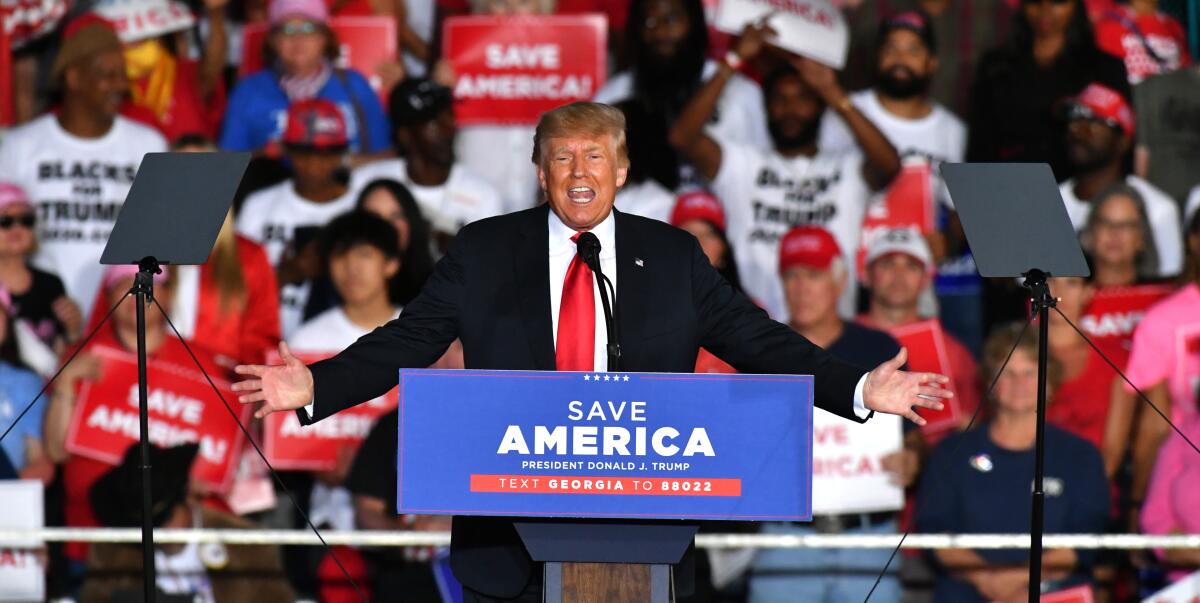 Former President Trump speaks before a crowd of supporters