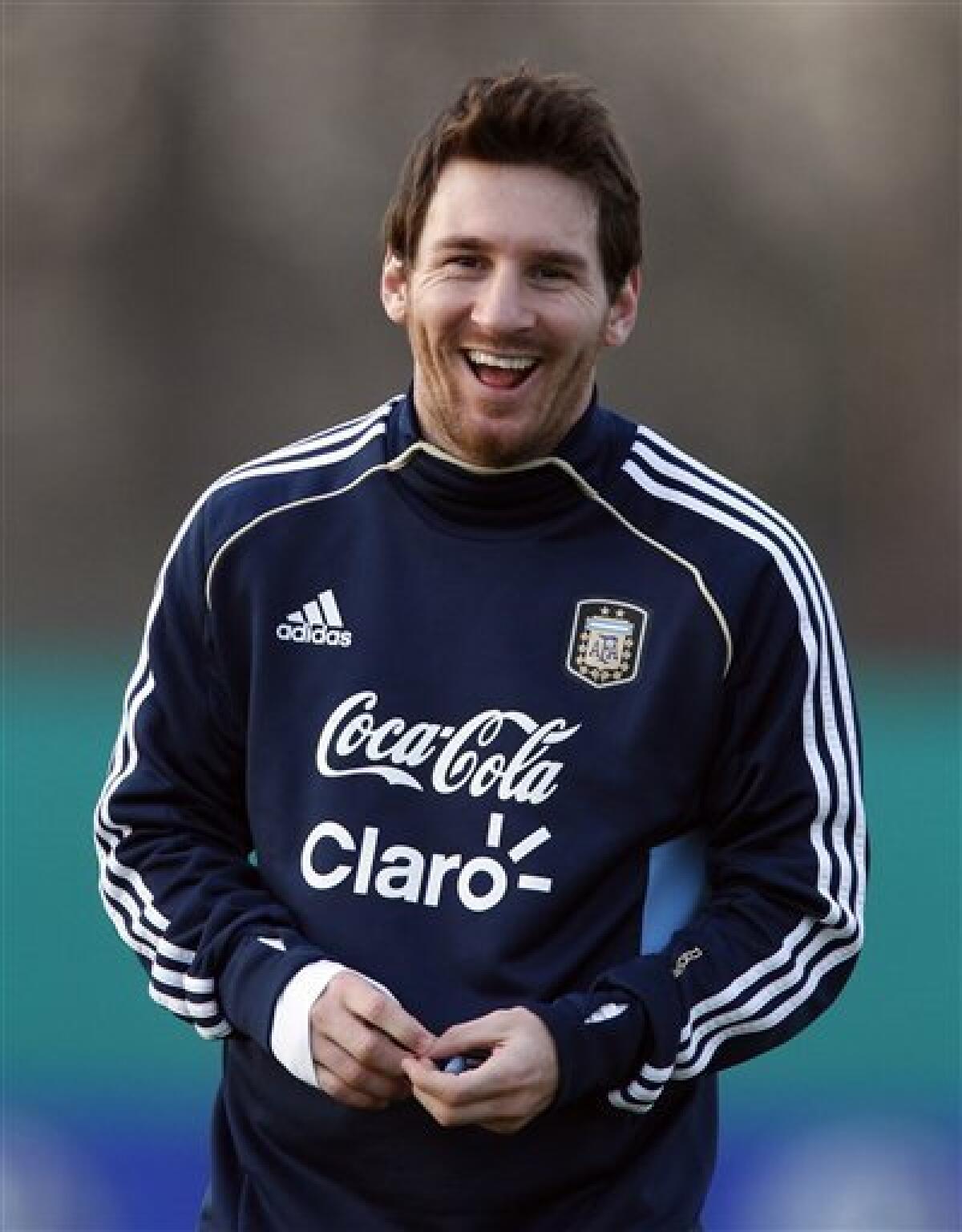 Argentina's Lionel Messi smiles at the end of a training session ahead of the upcoming 2011 Copa America in Buenos Aires, Argentina, Wednesday, June 29, 2011. Argentina will host the Copa America soccer tournament July 1-24. (AP Photo/Natacha Pisarenko)
