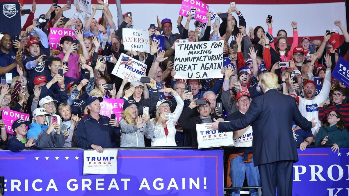 President Trump acknowledges supporters at a rally in Washington, Mich., on April 28.
