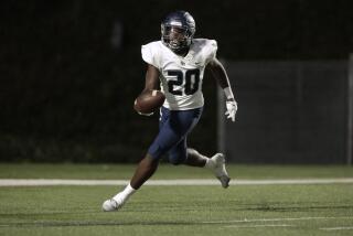 COSTA MESA, CA - SEPTEMBER 15: Sierra Canyon linebacker De'markus Barnes takes his fourth quarter interception in for a touchdown against Orange Lutheran at Orange Coast College in Costa Mesa, CA on Friday, Sept. 15, 2023. (Myung J. Chun / Los Angeles Times)