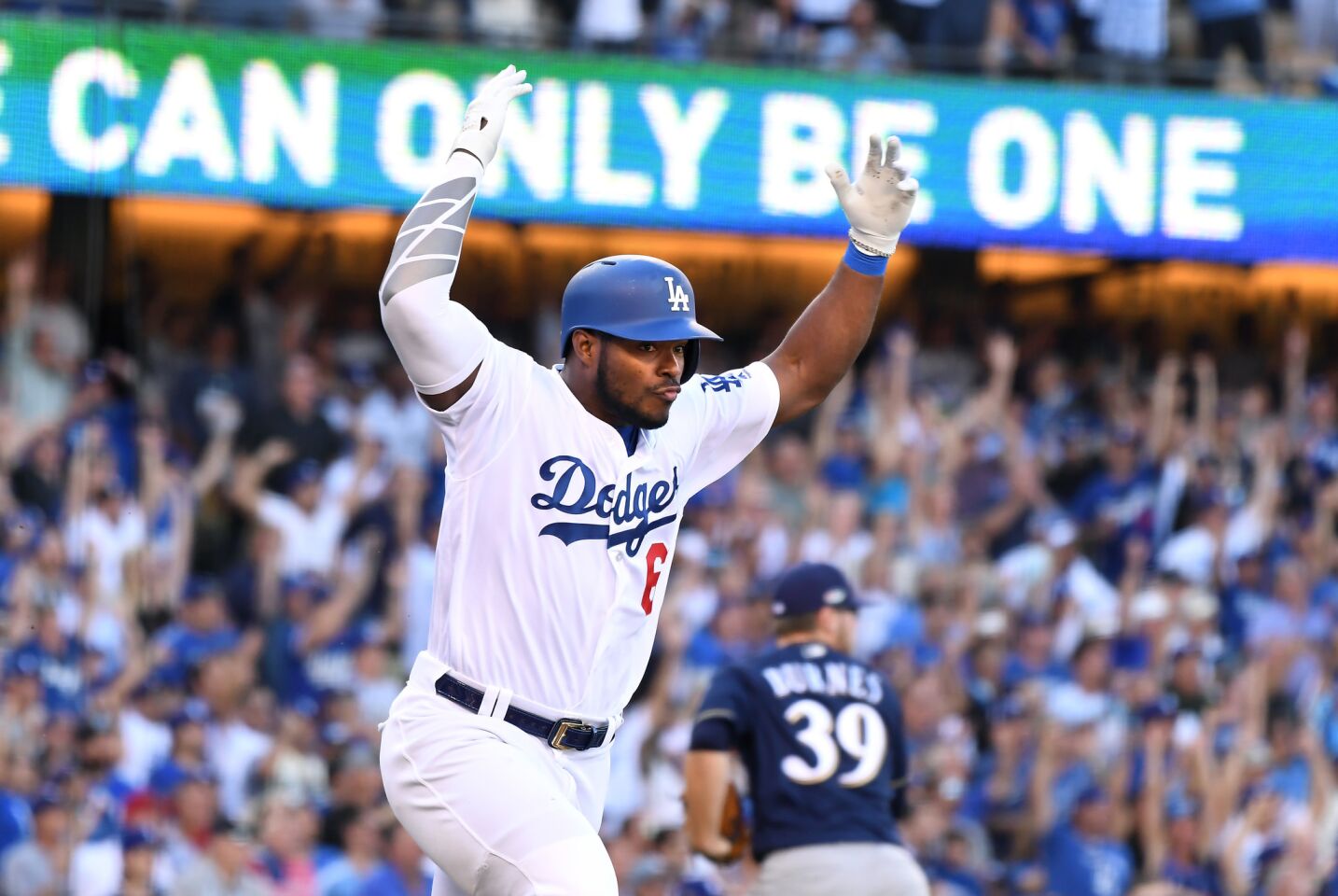 Dodgers pinch hitter Yasiel Puig celebrates his RBI single against the Brewers inthe 6th inning.