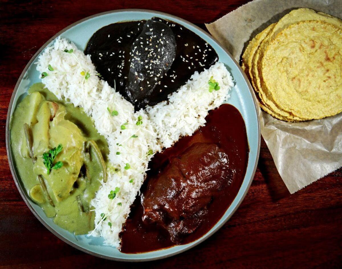 Madre's pecado de mole plate, with coloradito, negro and verde moles.
