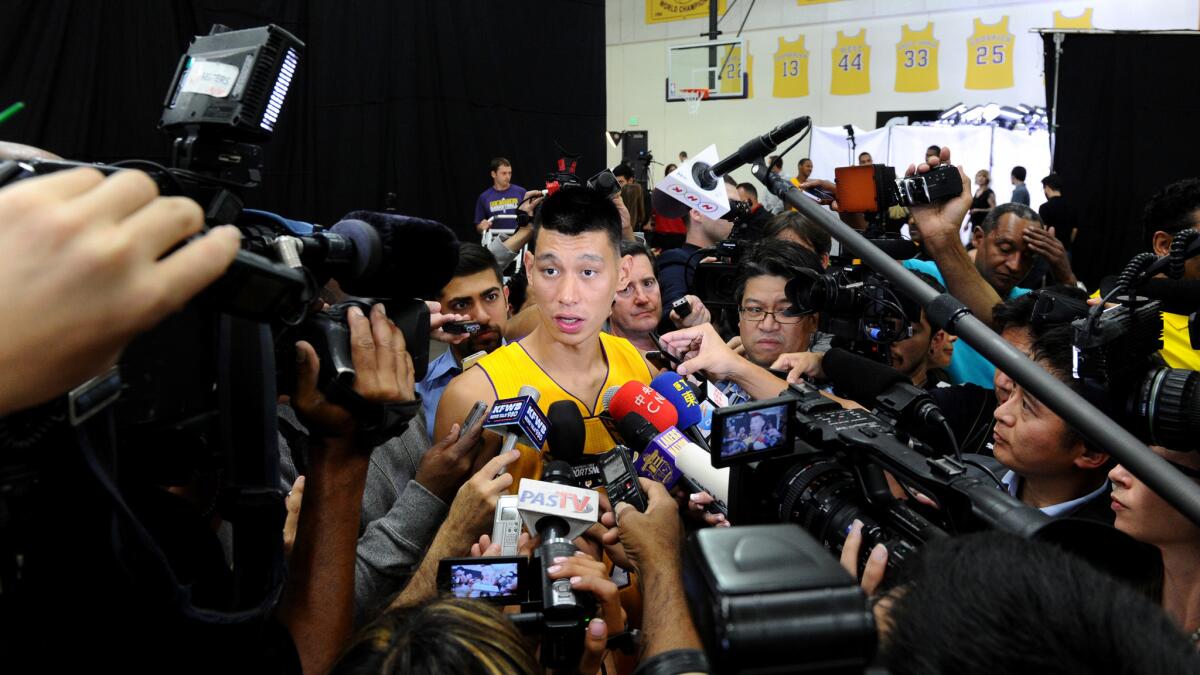 Lakers guard Jeremy Lin answers questions from reporters during the team's media day in El Segundo on Sept. 29.