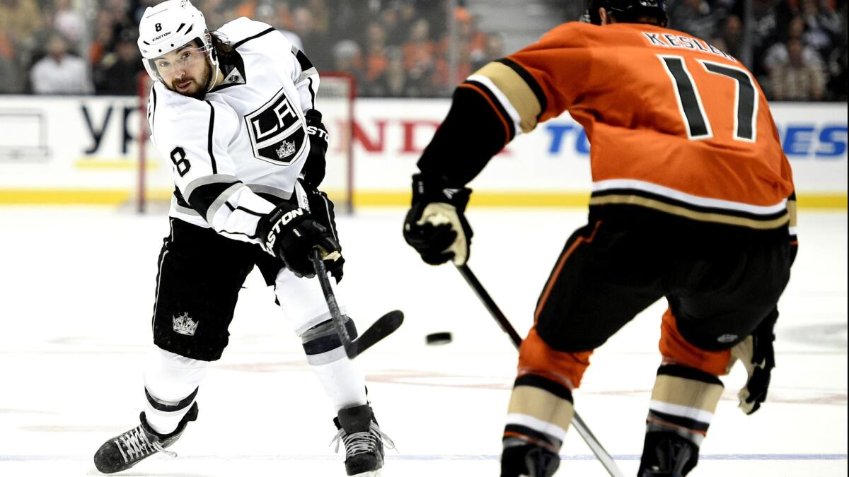 Kings defenseman Drew Doughty attempts to shoot the puck past Ducks center Ryan Kesler during the first period of a game Feb. 28.