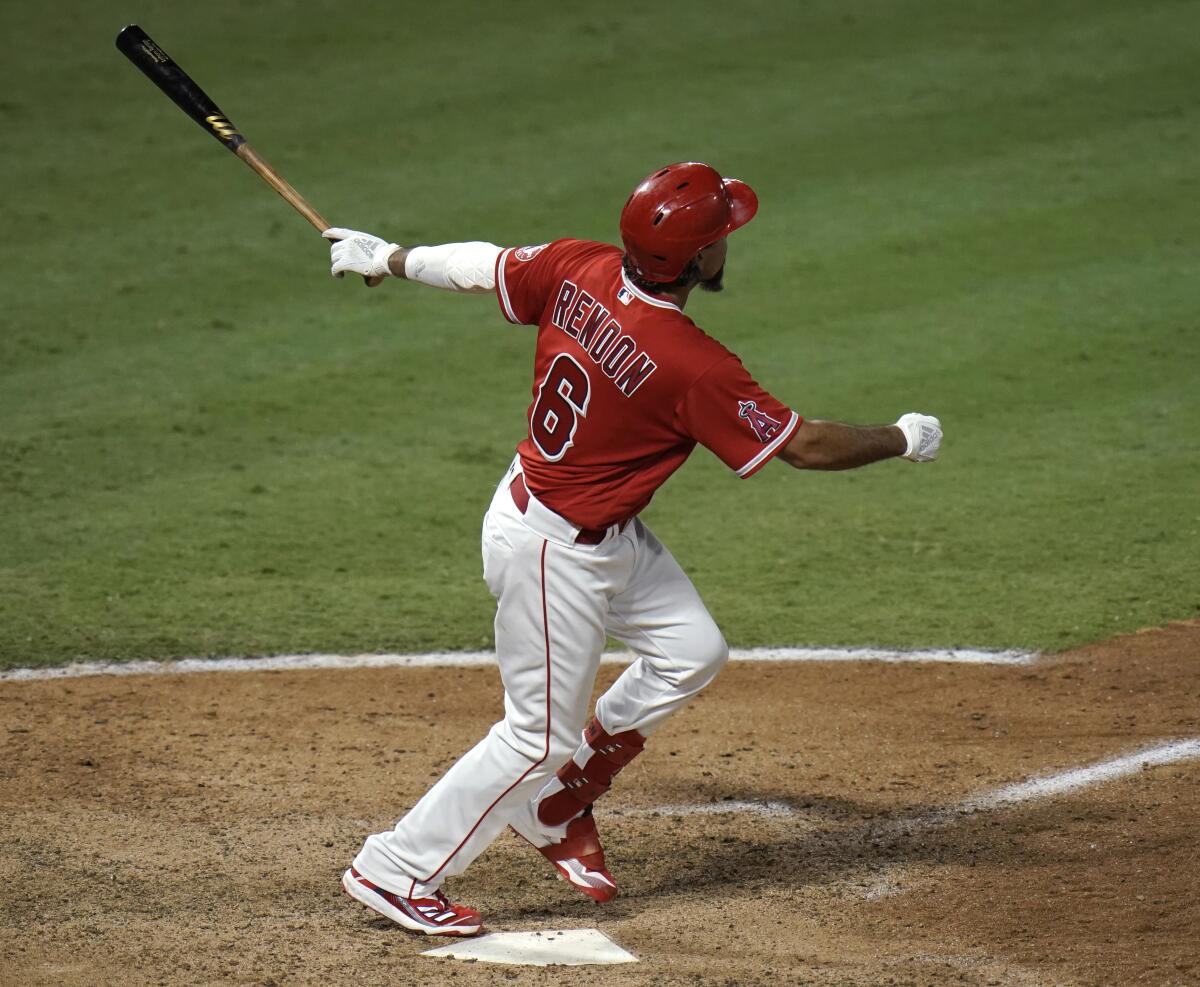 The Angels' Anthony Rendon connects for a go-ahead, three-run homer in the seventh inning of the nightcap game Saturday.