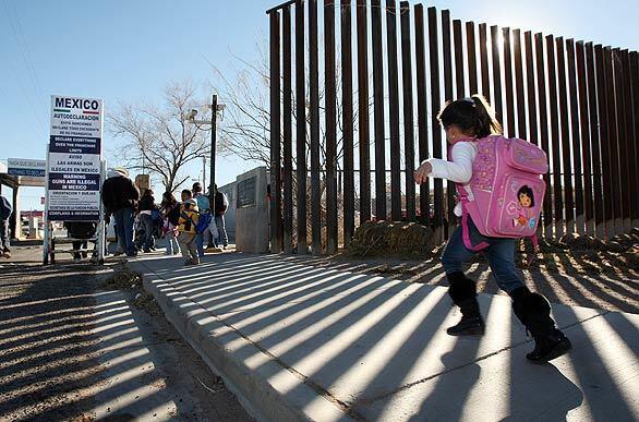 Schoolchildren scamper across the border