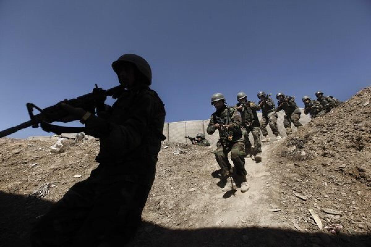 Afghan National Army commandos practice a house-clearing operation during training with U.S. forces on the outskirts of Kabul in March 2011. Special forces training of local security forces in countries afflicted with regional conflicts involving Islamic extremist groups would spare the U.S. direct involvement and its consequences, international security experts say.