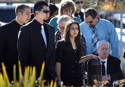 Mourners arrive at Holy Name of Mary Catholic Church in San Dimas to celebrate a Mass for the nine members of a Covina family killed during a Christmas Eve shooting rampage.