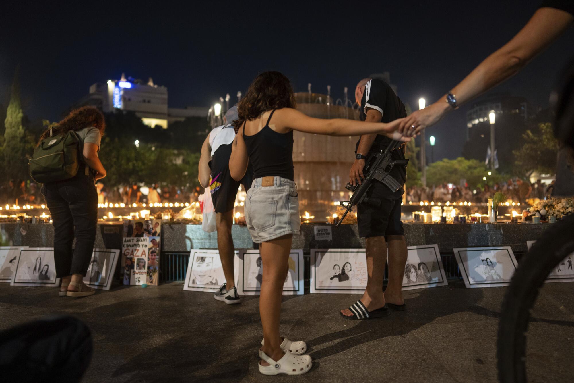 People at a candlelight vigil marking a month since Hamas' attack on Israel