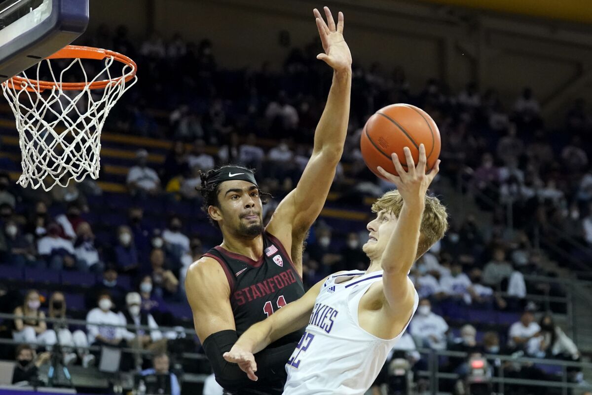 Washington guard Cole Bajema, right, looks to shoot against Stanford forward Jaiden Delaire, left, during the first half of an NCAA college basketball game, Saturday, Jan. 15, 2022, in Seattle. (AP Photo/Ted S. Warren)