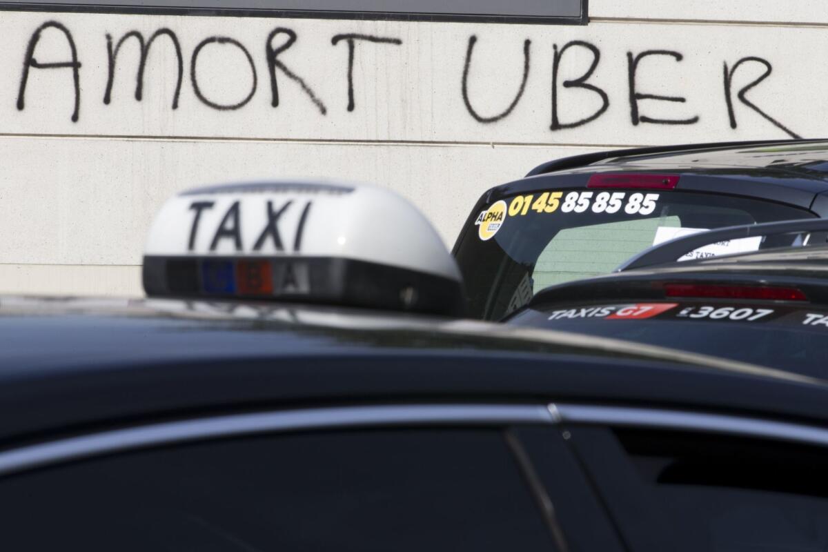 Paris graffiti reading "Death to Uber" during tax drivers' protests of the ride-summoning service last week.