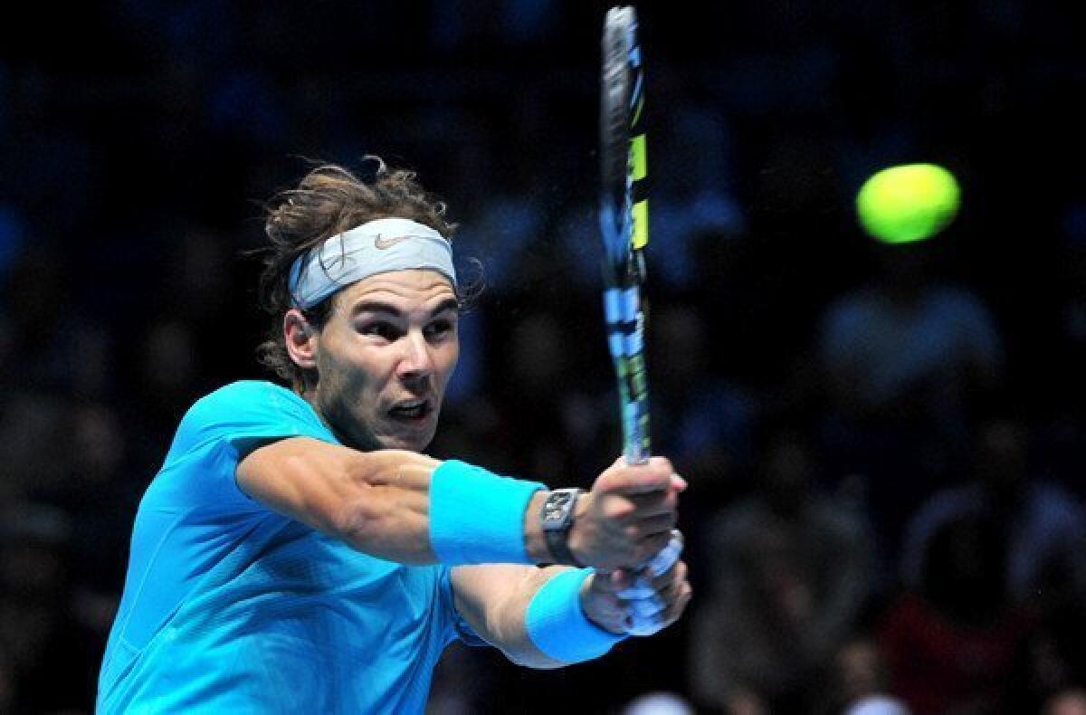 Rafael Nadal returns a shot against Tomas Berdych during their match at the ATP World Tour Finals on Friday in London.